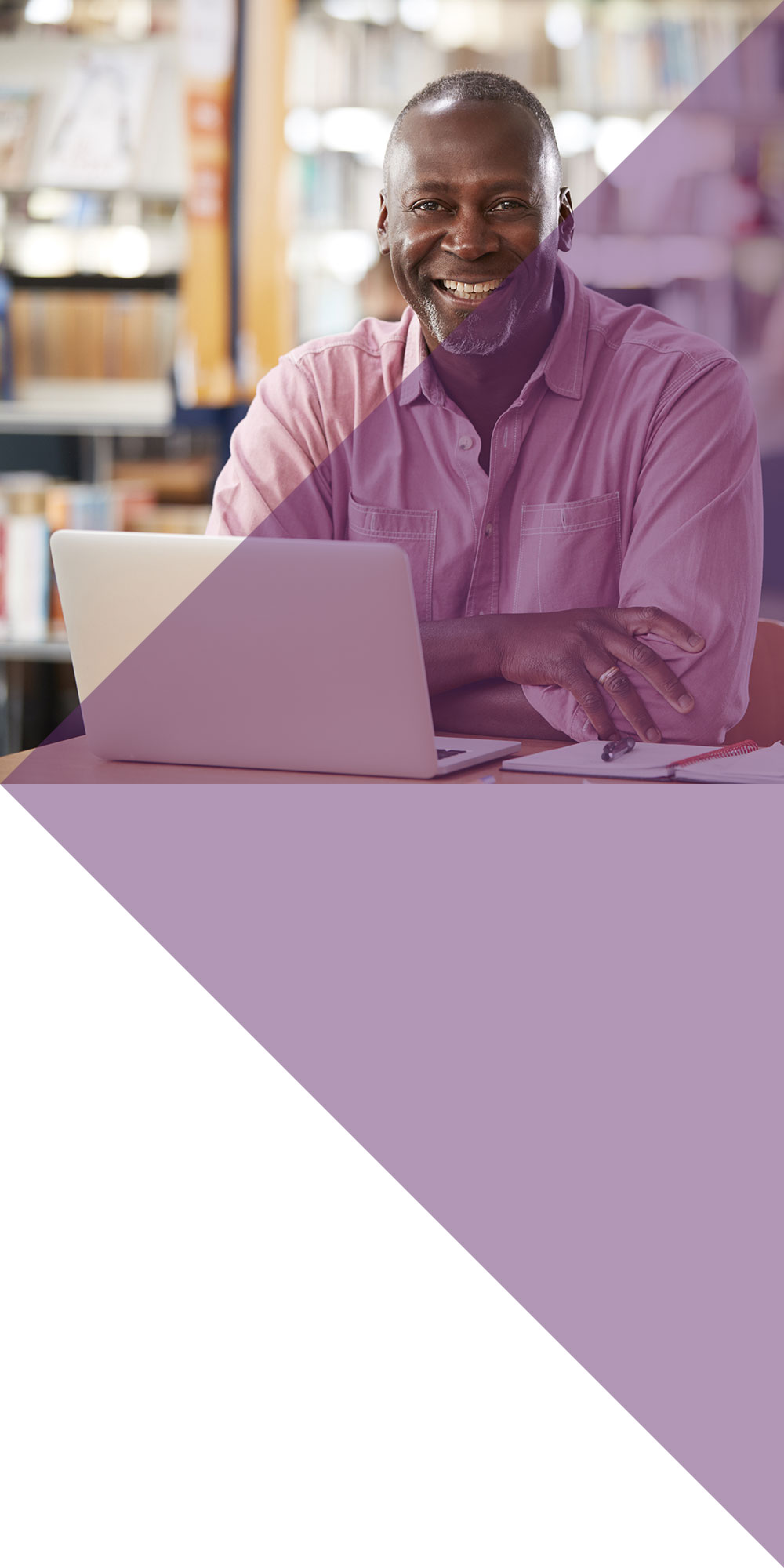 Adult black man setting at a laptop
